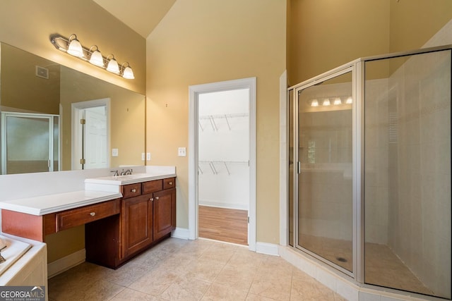 203 Crescent Moon Way, Canton, GA 30114 - bathroom with a shower stall, vanity, tile patterned flooring, and high vaulted ceiling