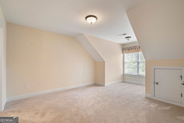 203 Crescent Moon Way, Canton, GA 30114 - bonus room with light colored carpet, vaulted ceiling, and baseboards