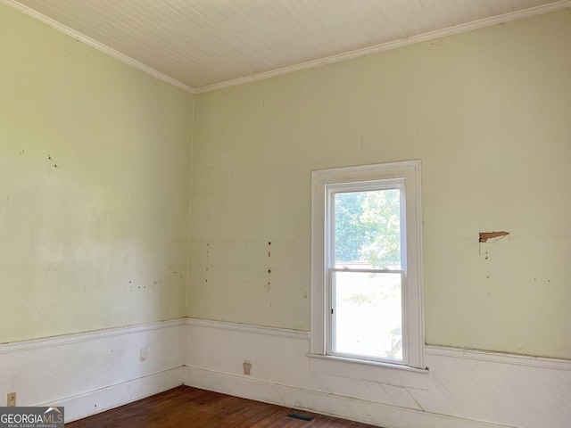 459 Railroad Ave, Flovilla, GA 30216 - spare room with crown molding, a wainscoted wall, and dark wood-style flooring