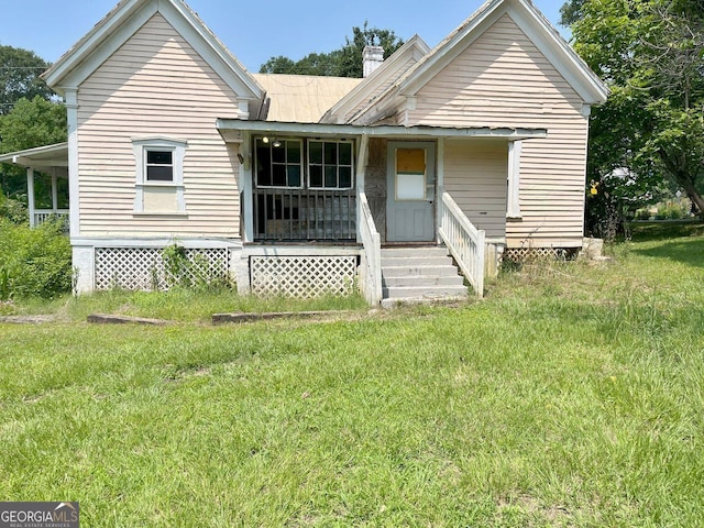 459 Railroad Ave, Flovilla, GA 30216 - rear view of property with a chimney, a lawn, and a porch