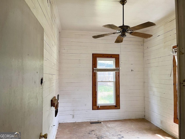 459 Railroad Ave, Flovilla, GA 30216 - unfurnished room with wooden walls, a ceiling fan, and ornamental molding