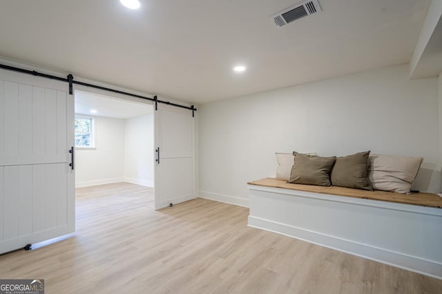 2825 Shea Way SW, Marietta, GA 30060 - below grade area with a barn door, light wood-style flooring, and recessed lighting