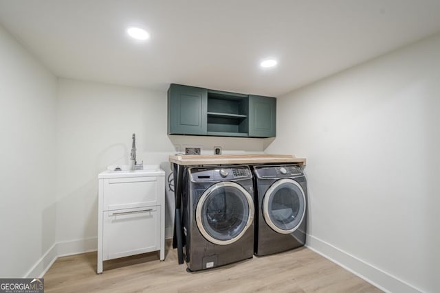 2825 Shea Way SW, Marietta, GA 30060 - laundry room featuring independent washer and dryer, cabinet space, light wood-style floors, and recessed lighting