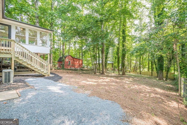 2825 Shea Way SW, Marietta, GA 30060 - view of yard featuring stairs, an outbuilding, and a sunroom