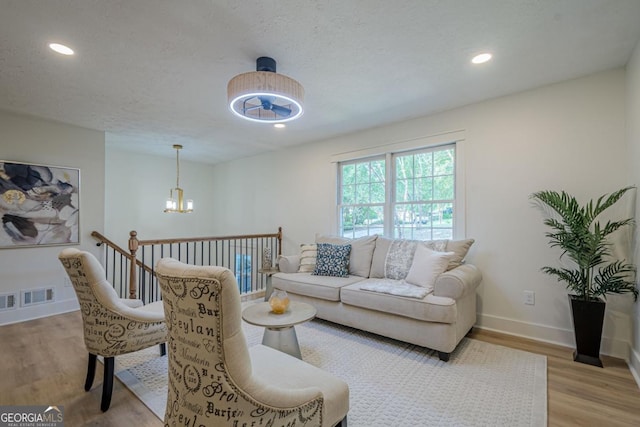 2825 Shea Way SW, Marietta, GA 30060 - living room with light wood-type flooring, a chandelier, and recessed lighting