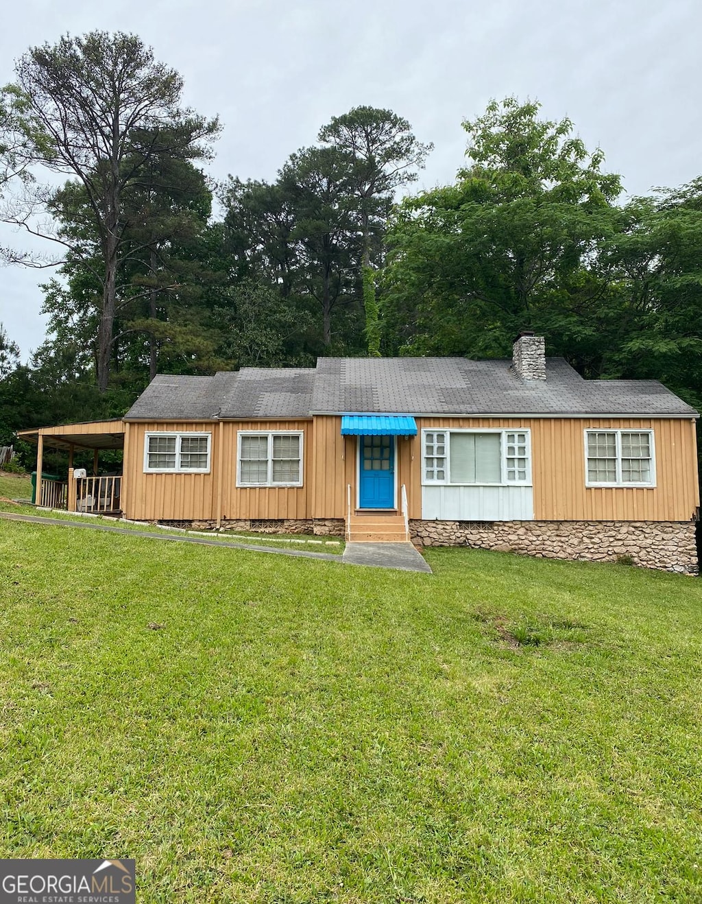 5094 Covington Hwy, Decatur, GA 30035 - view of front of home featuring a front yard and a chimney