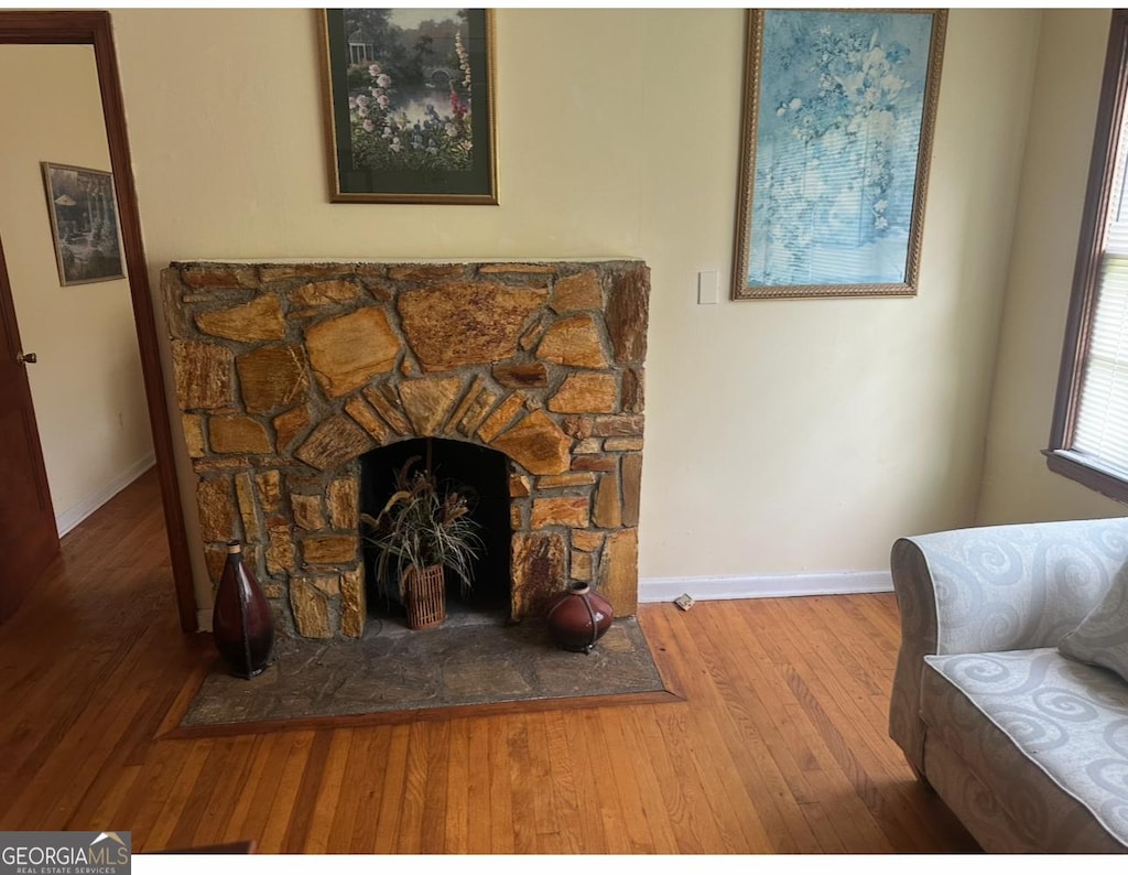 5094 Covington Hwy, Decatur, GA 30035 - detailed view of wood finished floors and a stone fireplace