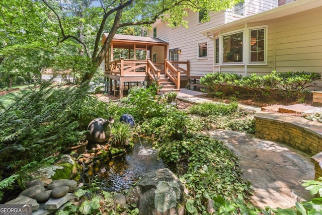 5240 Arrie Way, Atlanta, GA 30360 - view of yard with a small pond and a wooden deck