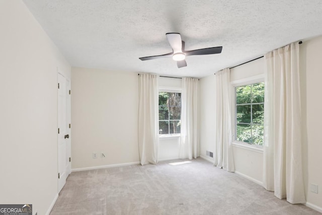 5240 Arrie Way, Atlanta, GA 30360 - spare room with ceiling fan, carpet, baseboards, and a textured ceiling