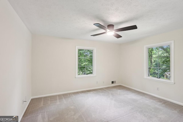 5240 Arrie Way, Atlanta, GA 30360 - carpeted empty room with a ceiling fan, a textured ceiling, and baseboards