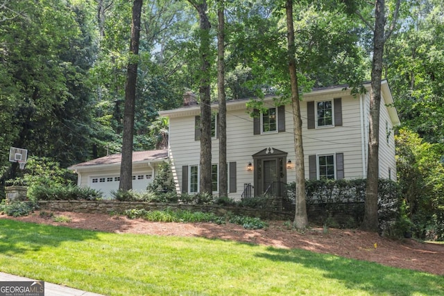 5240 Arrie Way, Atlanta, GA 30360 - colonial inspired home featuring a garage, a front yard, a chimney, and view of scattered trees