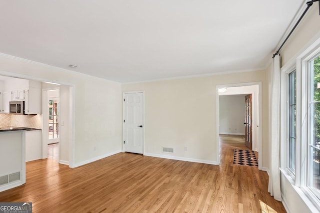 5240 Arrie Way, Atlanta, GA 30360 - unfurnished living room with light wood finished floors, baseboards, and ornamental molding