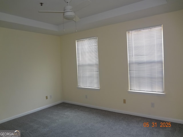 245 Amal Dr SW Apt 2010, Atlanta, GA 30315 - spare room featuring ceiling fan, carpet flooring, a tray ceiling, baseboards, and fire sprinkler in ceiling