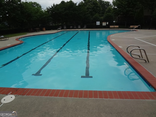 245 Amal Dr SW Apt 2010, Atlanta, GA 30315 - community pool featuring a patio and view of scattered trees