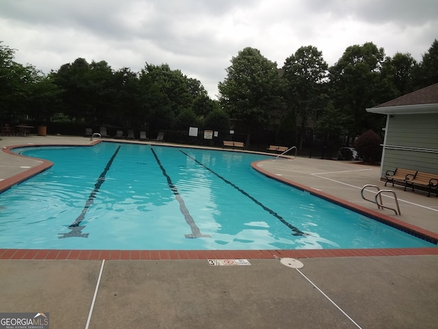 245 Amal Dr SW Apt 2010, Atlanta, GA 30315 - community pool with a patio and view of scattered trees