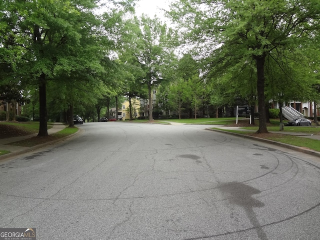 245 Amal Dr SW Apt 2010, Atlanta, GA 30315 - view of asphalt road with curbs and sidewalks
