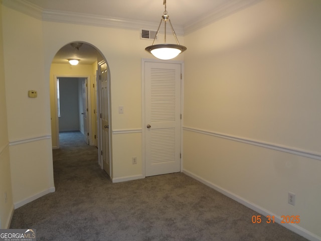 245 Amal Dr SW Apt 2010, Atlanta, GA 30315 - spare room featuring carpet floors, arched walkways, crown molding, and baseboards