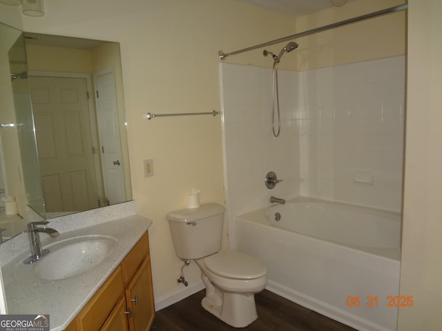 245 Amal Dr SW Apt 2010, Atlanta, GA 30315 - full bathroom with toilet, vanity, wood finished floors, tub / shower combination, and baseboards