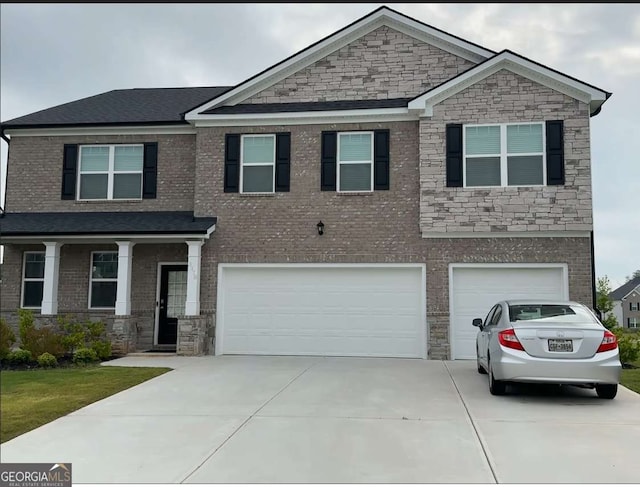 3378 English Elm Way, Loganville, GA 30052 - craftsman inspired home featuring driveway, an attached garage, and stone siding