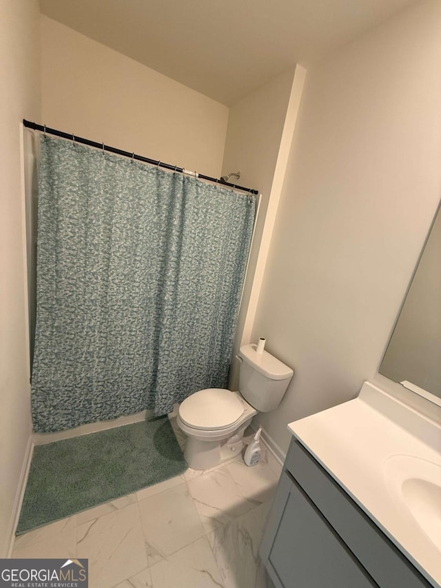 3378 English Elm Way, Loganville, GA 30052 - bathroom with marble finish floors, vanity, toilet, and baseboards