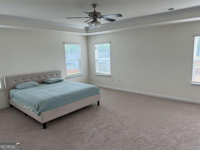 3378 English Elm Way, Loganville, GA 30052 - carpeted bedroom with baseboards, a tray ceiling, and a ceiling fan