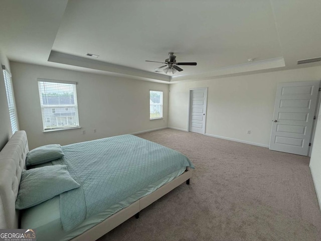 3378 English Elm Way, Loganville, GA 30052 - carpeted bedroom featuring a raised ceiling, baseboards, and a ceiling fan