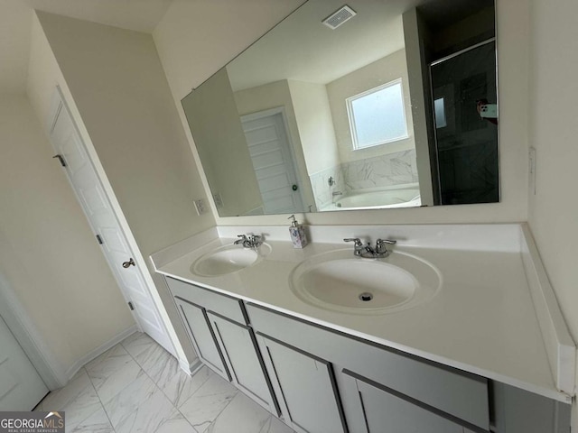 3378 English Elm Way, Loganville, GA 30052 - full bath with marble finish floors, a garden tub, and double vanity
