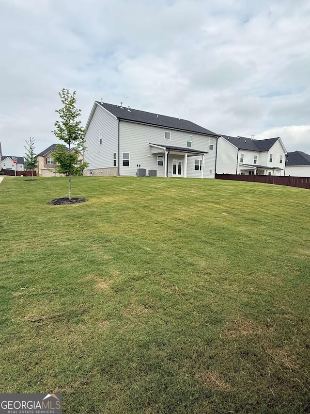 3378 English Elm Way, Loganville, GA 30052 - rear view of house featuring a yard