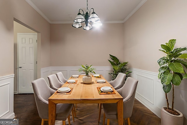 171 Stillwood Dr, Newnan, GA 30265 - dining space featuring a chandelier, crown molding, a wainscoted wall, and a decorative wall