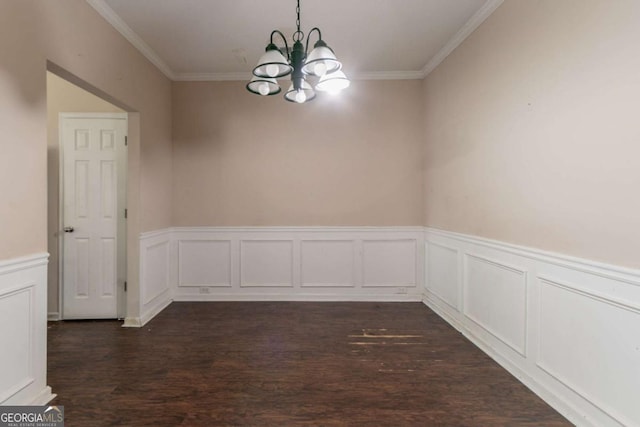 171 Stillwood Dr, Newnan, GA 30265 - unfurnished dining area featuring a chandelier, wainscoting, dark wood-type flooring, and ornamental molding
