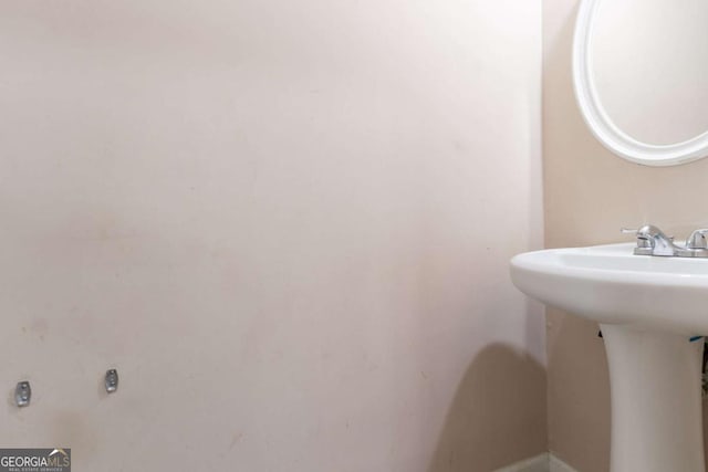 171 Stillwood Dr, Newnan, GA 30265 - bathroom featuring a sink and baseboards