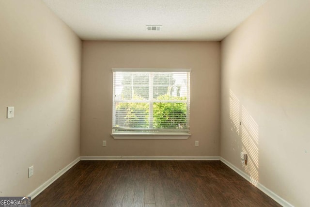 171 Stillwood Dr, Newnan, GA 30265 - unfurnished room with dark wood finished floors and baseboards