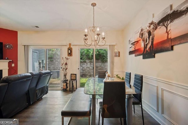 780 Nehemiah Ln SW, Atlanta, GA 30331 - dining room with a chandelier, dark wood-style floors, and wainscoting