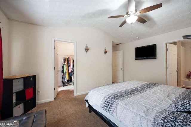 780 Nehemiah Ln SW, Atlanta, GA 30331 - bedroom featuring a walk in closet, carpet flooring, lofted ceiling, a closet, and baseboards