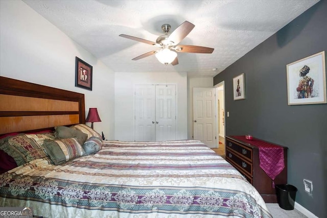 780 Nehemiah Ln SW, Atlanta, GA 30331 - bedroom featuring baseboards, a closet, a ceiling fan, and a textured ceiling