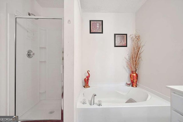 780 Nehemiah Ln SW, Atlanta, GA 30331 - full bath with a bath, a shower stall, vanity, and a textured ceiling