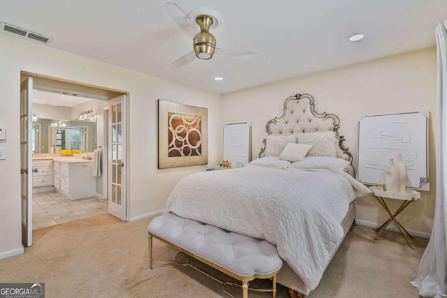 1777 E Gate Trl, Stone Mountain, GA 30087 - bedroom with light carpet, baseboards, connected bathroom, and ceiling fan