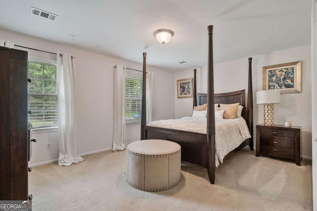 1777 E Gate Trl, Stone Mountain, GA 30087 - bedroom featuring light colored carpet, multiple windows, and baseboards