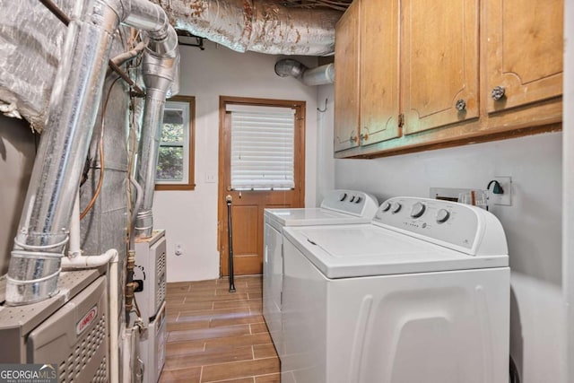1777 E Gate Trl, Stone Mountain, GA 30087 - washroom with independent washer and dryer, cabinet space, and wood finish floors