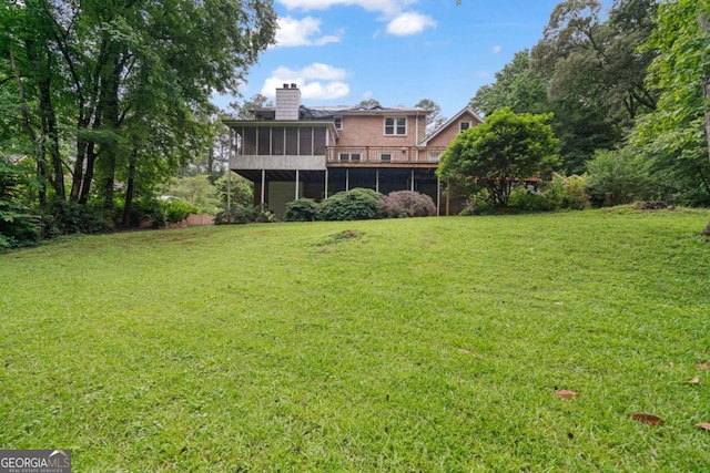 1777 E Gate Trl, Stone Mountain, GA 30087 - view of grassy yard with a sunroom