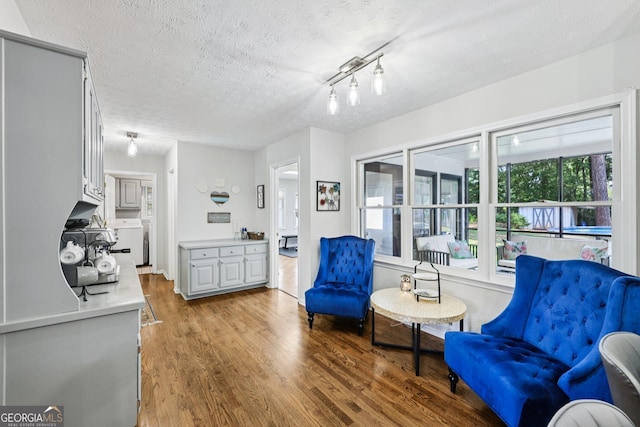 130 Emerald Dr, Mcdonough, GA 30253 - living area with a textured ceiling and wood finished floors
