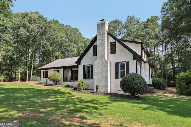 130 Emerald Dr, Mcdonough, GA 30253 - view of side of property with a chimney, brick siding, a lawn, and crawl space