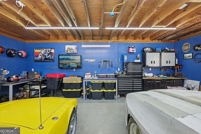130 Emerald Dr, Mcdonough, GA 30253 - bedroom with a workshop area and concrete floors