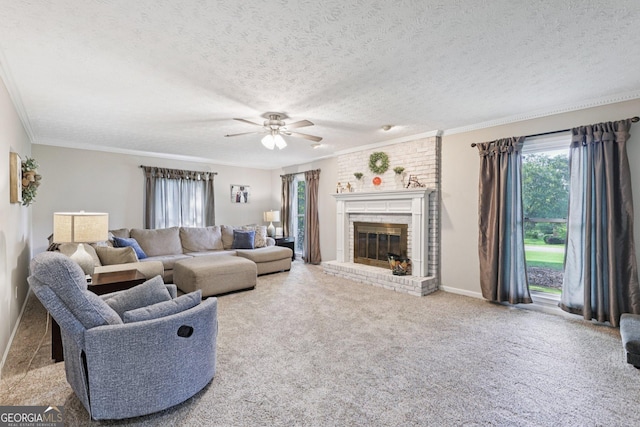130 Emerald Dr, Mcdonough, GA 30253 - living room with a fireplace, a textured ceiling, ceiling fan, ornamental molding, and carpet flooring