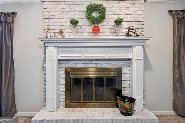 130 Emerald Dr, Mcdonough, GA 30253 - detailed view of a brick fireplace and carpet flooring