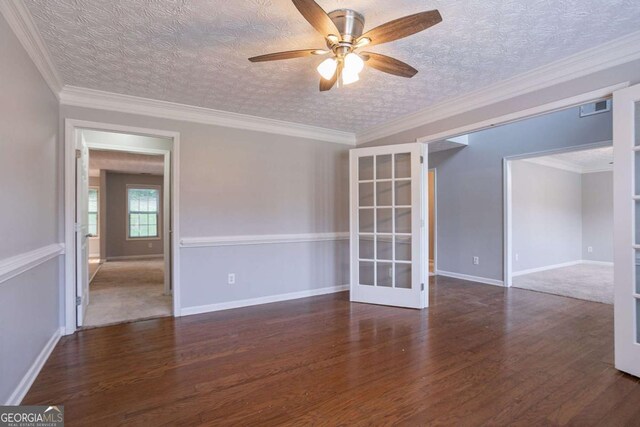2482 Brittany Park Ln, Ellenwood, GA 30294 - empty room with french doors, wood finished floors, a ceiling fan, and baseboards