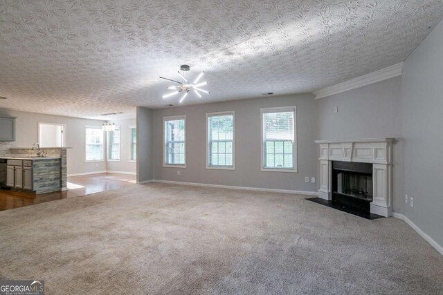 2482 Brittany Park Ln, Ellenwood, GA 30294 - unfurnished living room with plenty of natural light, carpet, and a chandelier