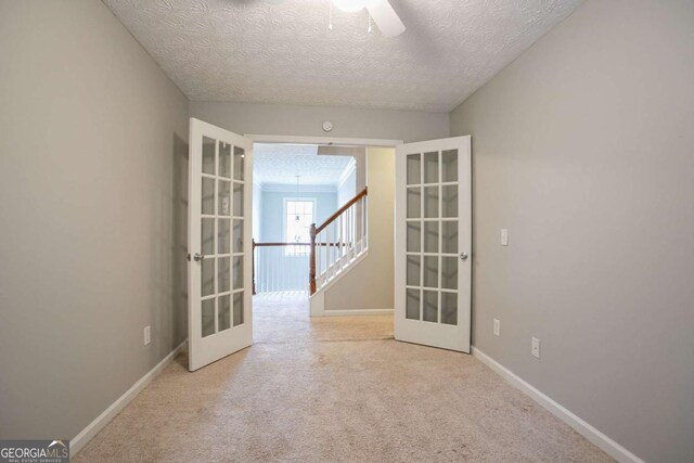 2482 Brittany Park Ln, Ellenwood, GA 30294 - unfurnished room featuring ceiling fan, healthy amount of natural light, baseboards, and a textured ceiling