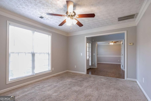 2482 Brittany Park Ln, Ellenwood, GA 30294 - carpeted spare room featuring a ceiling fan, ornamental molding, and baseboards