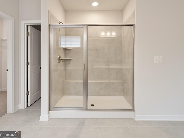 3468 Jasmine Way SW, South Fulton, GA 30331 - bathroom featuring tile patterned flooring, a stall shower, and baseboards